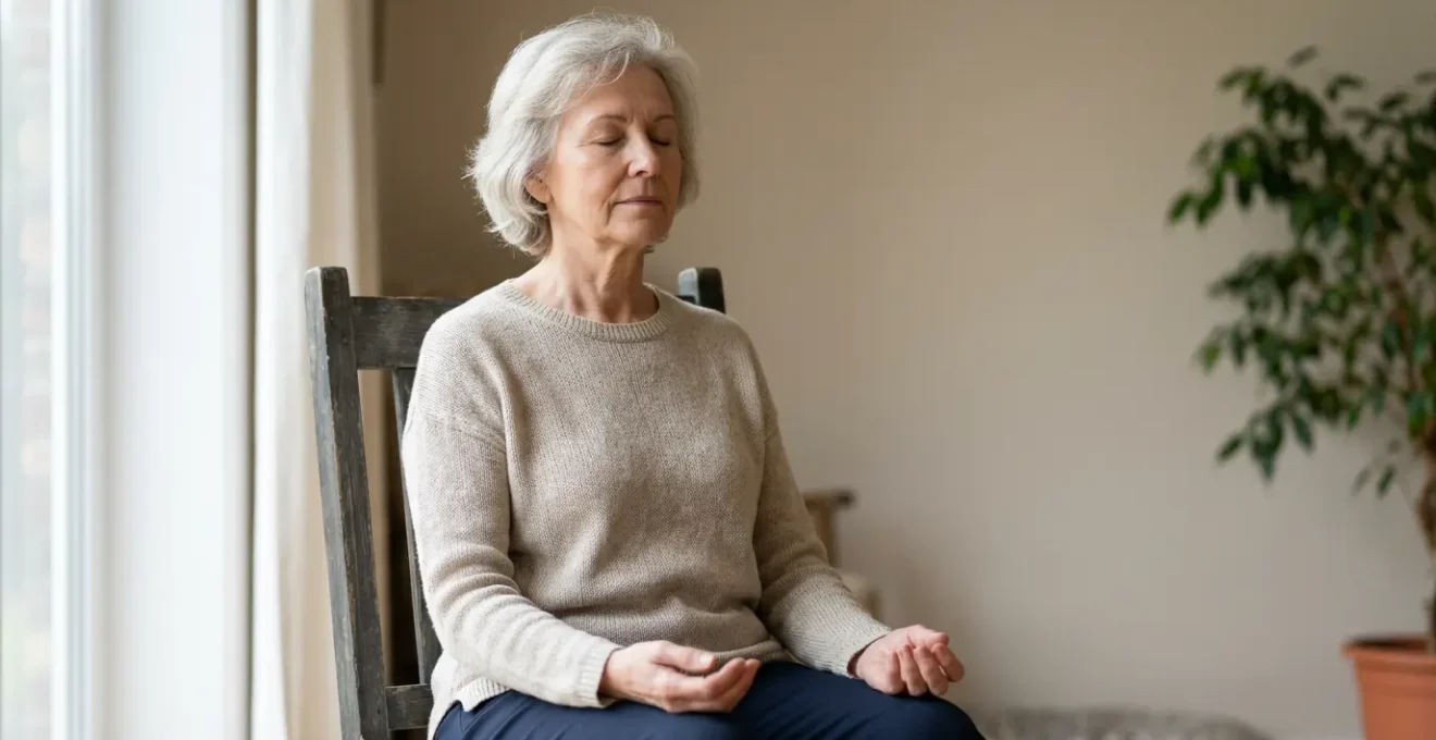 Senior practicing gentle chair yoga breathing exercise for arthritis pain management in comfortable home setting