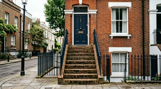 Elegant Victorian terraced house entrance with steep front steps and iron handrails adapted for rollator accessibility