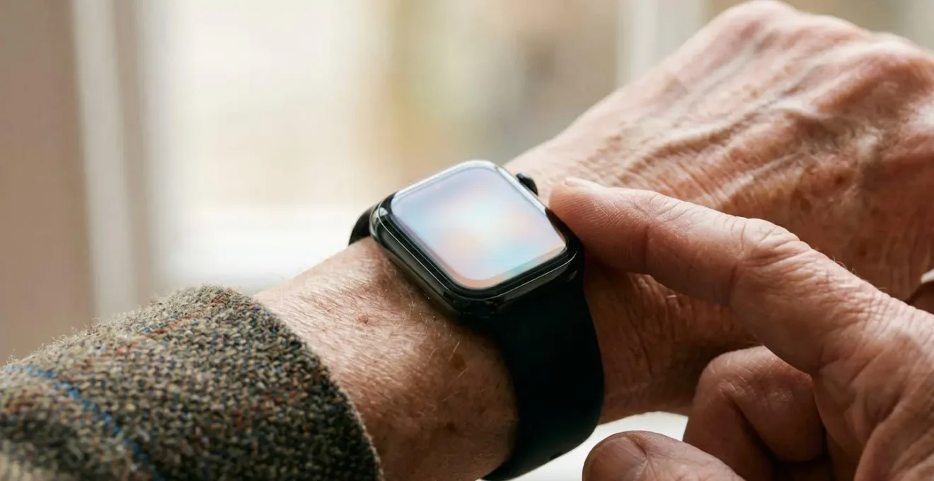 Close-up of senior person's wrist wearing smartwatch during heart rhythm measurement