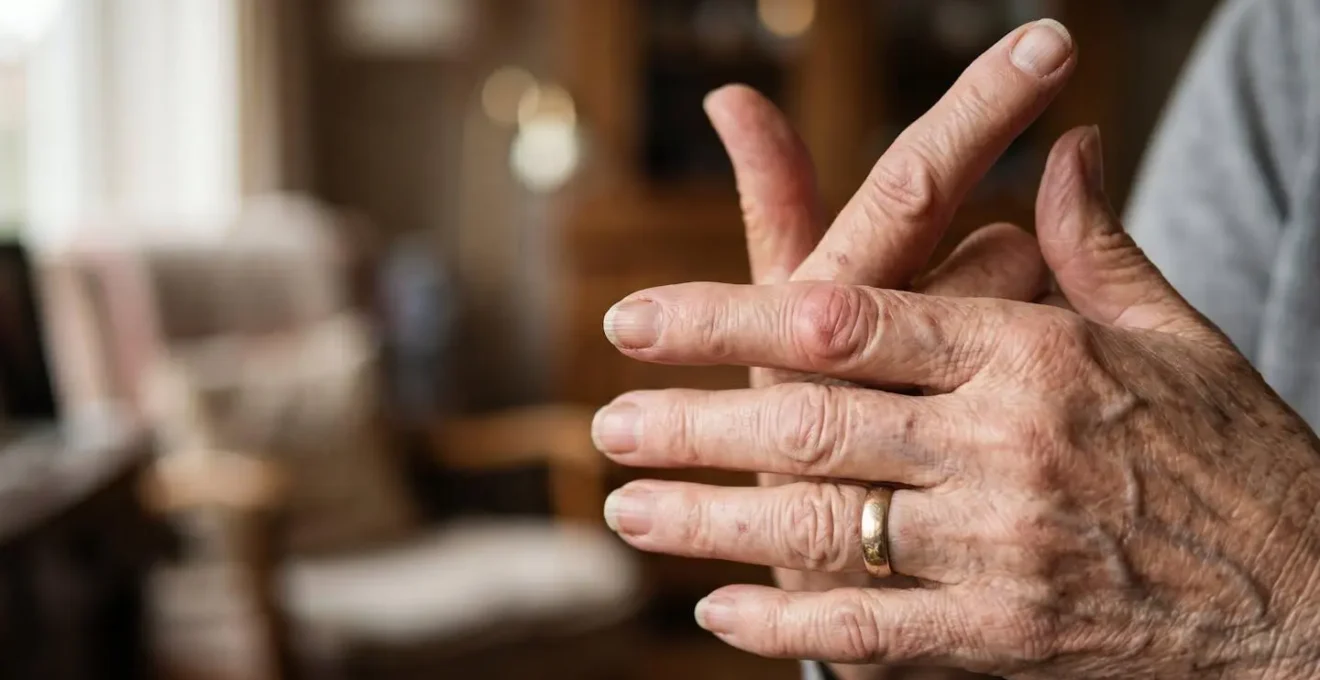 Macro close-up of senior hands using simple wellness tracking method with natural light