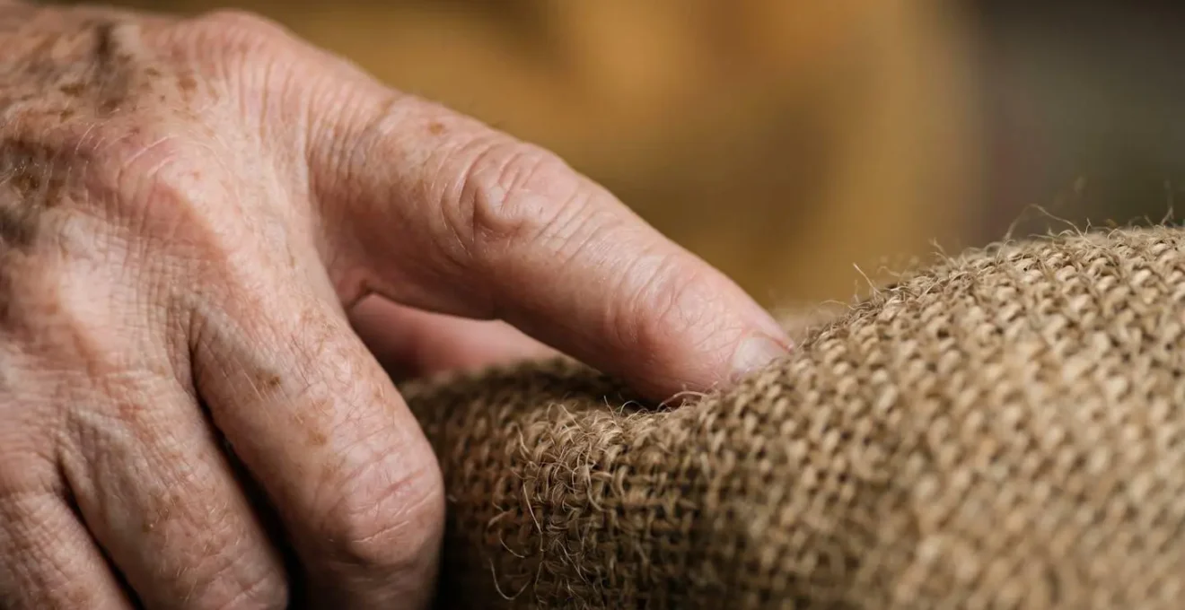 Extreme close-up macro shot of hands engaging in tactile sensory exploration activity